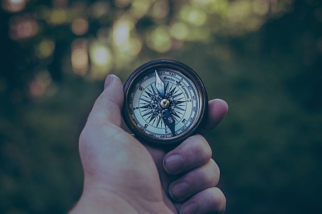 Compass in man's hand