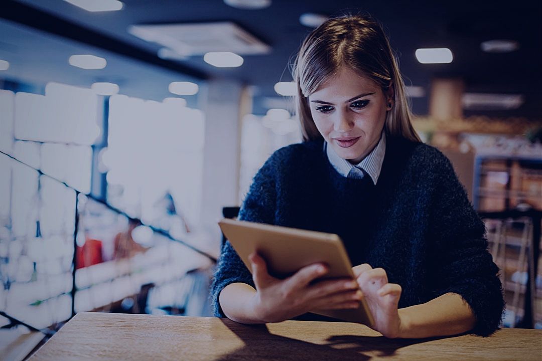 Woman reading on tablet