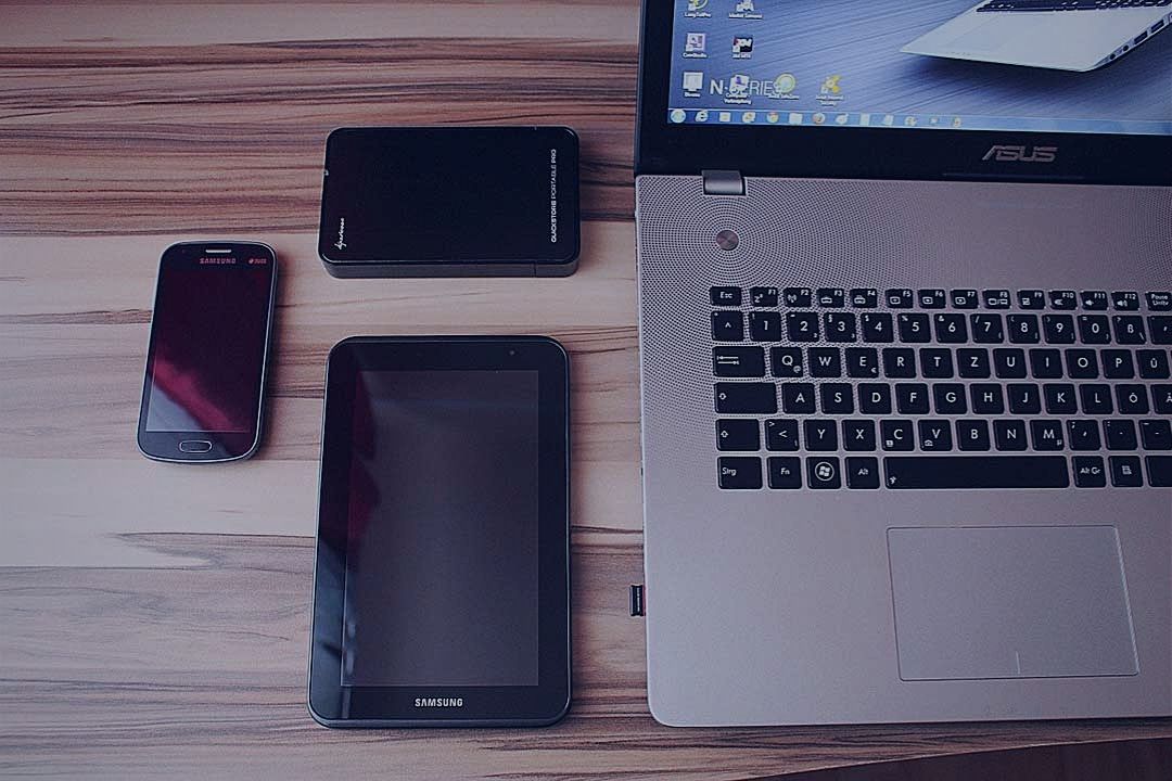 Tablet, smartphone and laptop on desk