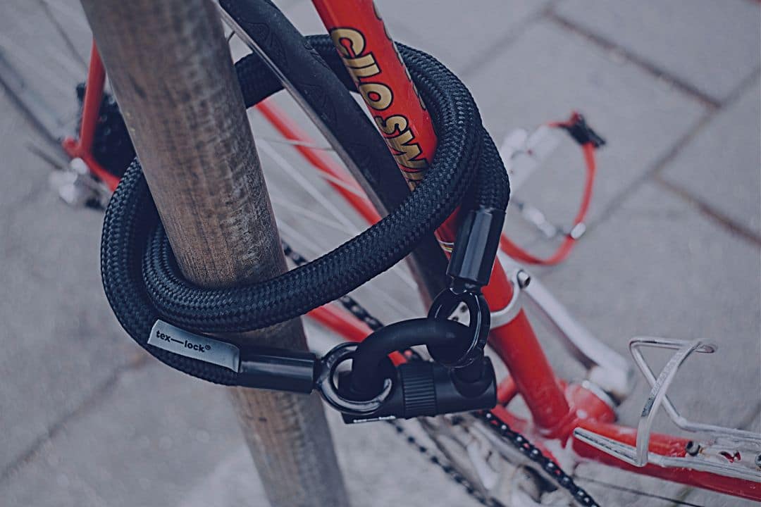 Closeup of bike chained to pole
