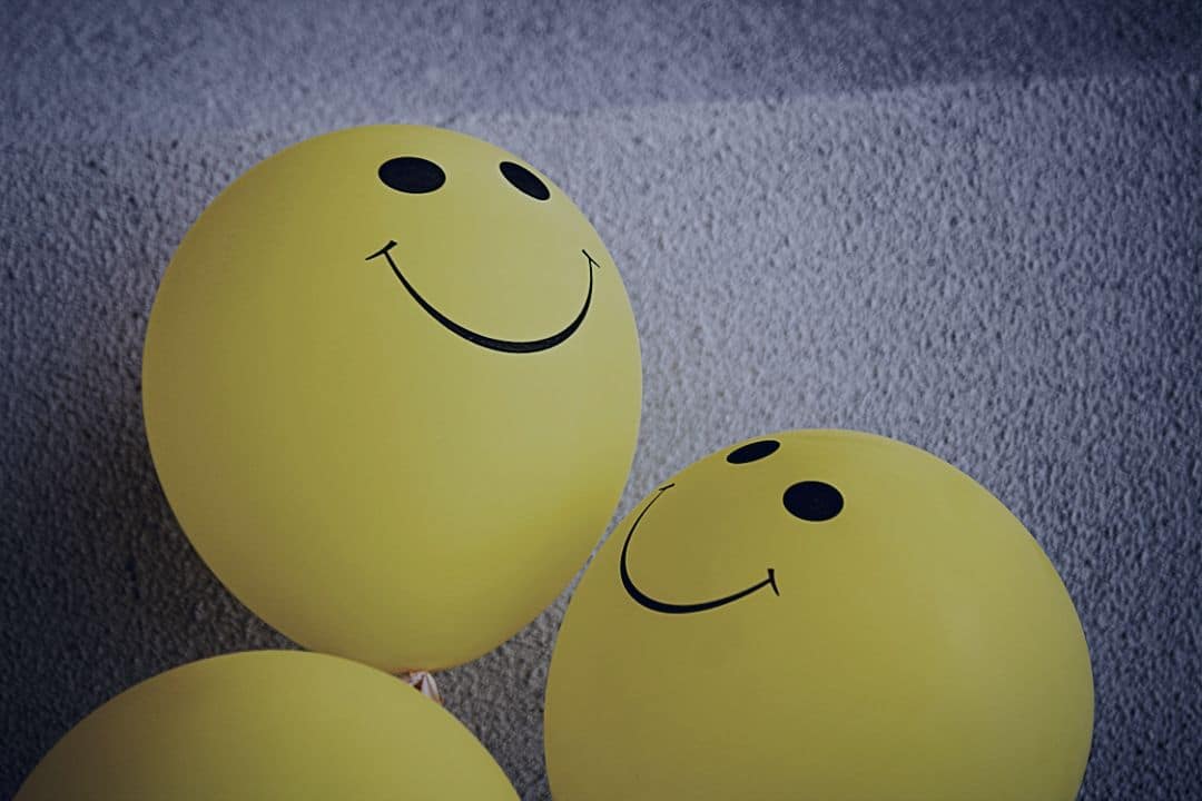 Yellow smiley face balloons