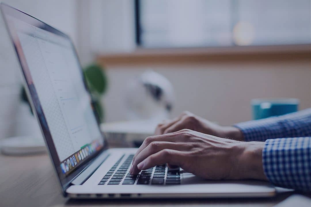 Man typing on laptop