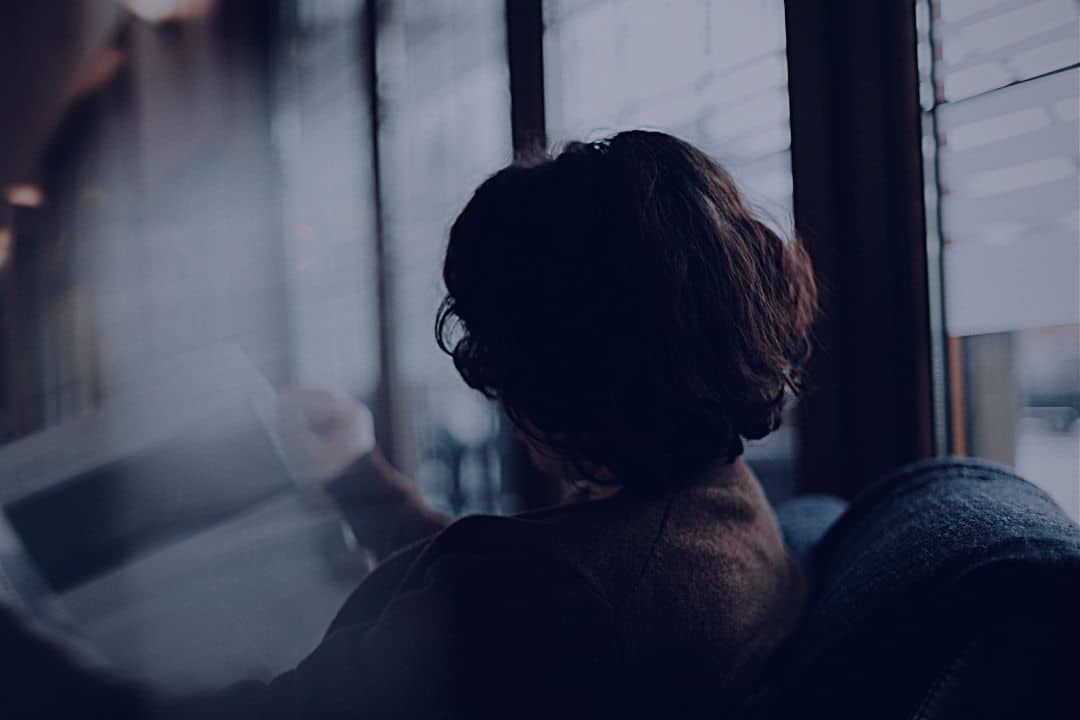 Woman reading newspaper