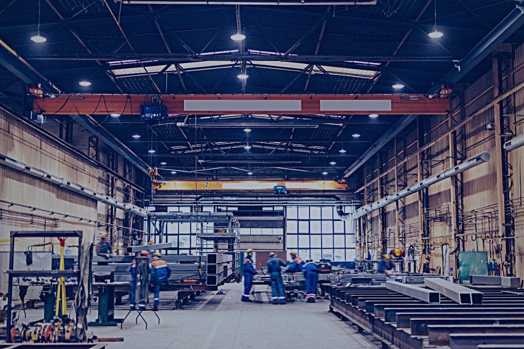 People working in large factory