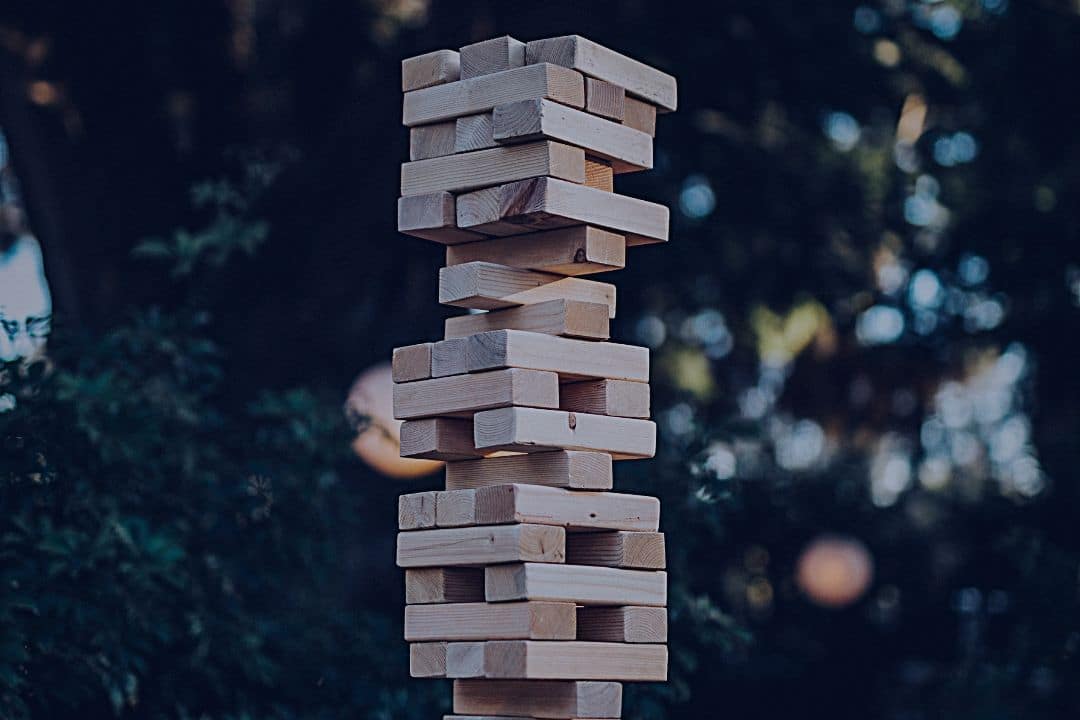 Wooden blocks balancing in a tall stack