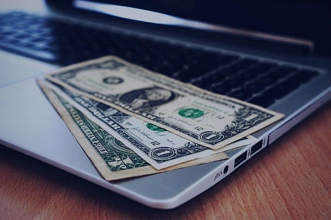 Money on open laptop