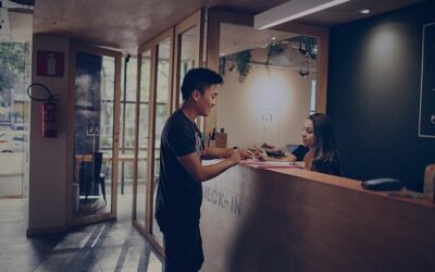 customer checking in at hotel desk