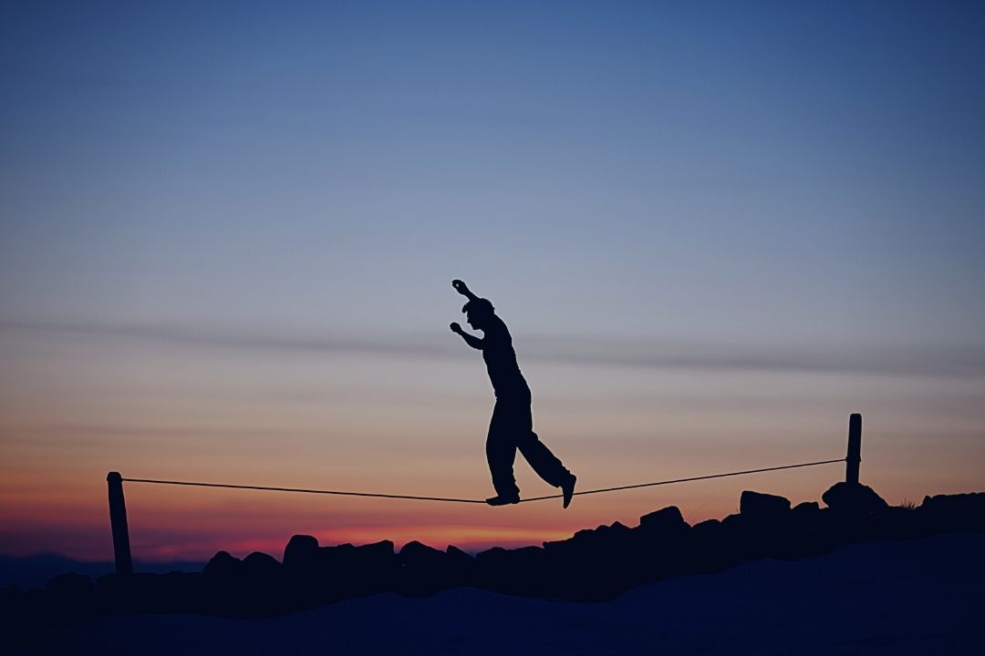 man tightrope walking