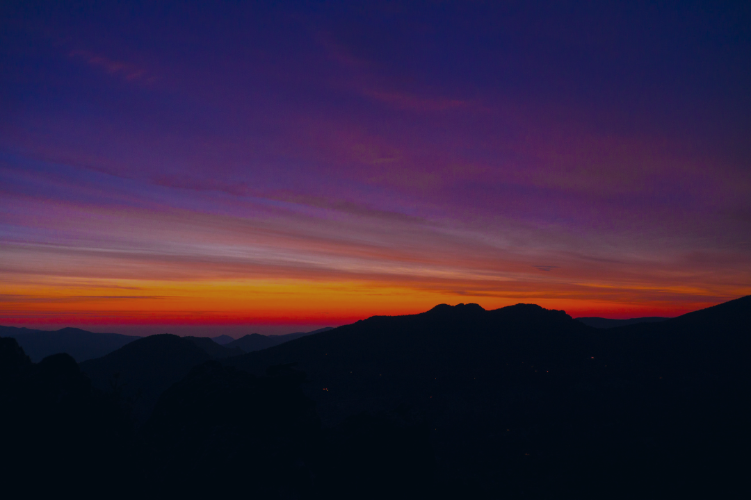 Sunset over mountains, approaching twilight